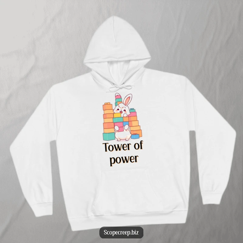 Funny hoodie featuring a fluffy bunny joyfully stacking oversized building blocks, designed for comfort and a touch of playful ambition.